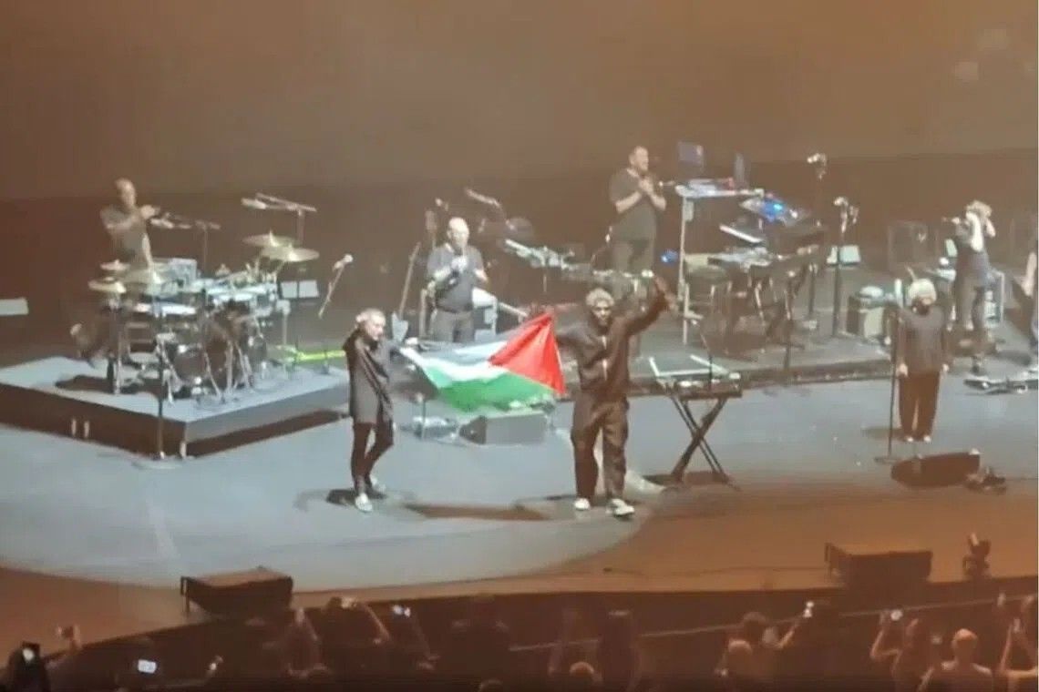 Massive Attack barred from Singapore after Palestinian flag display at concert