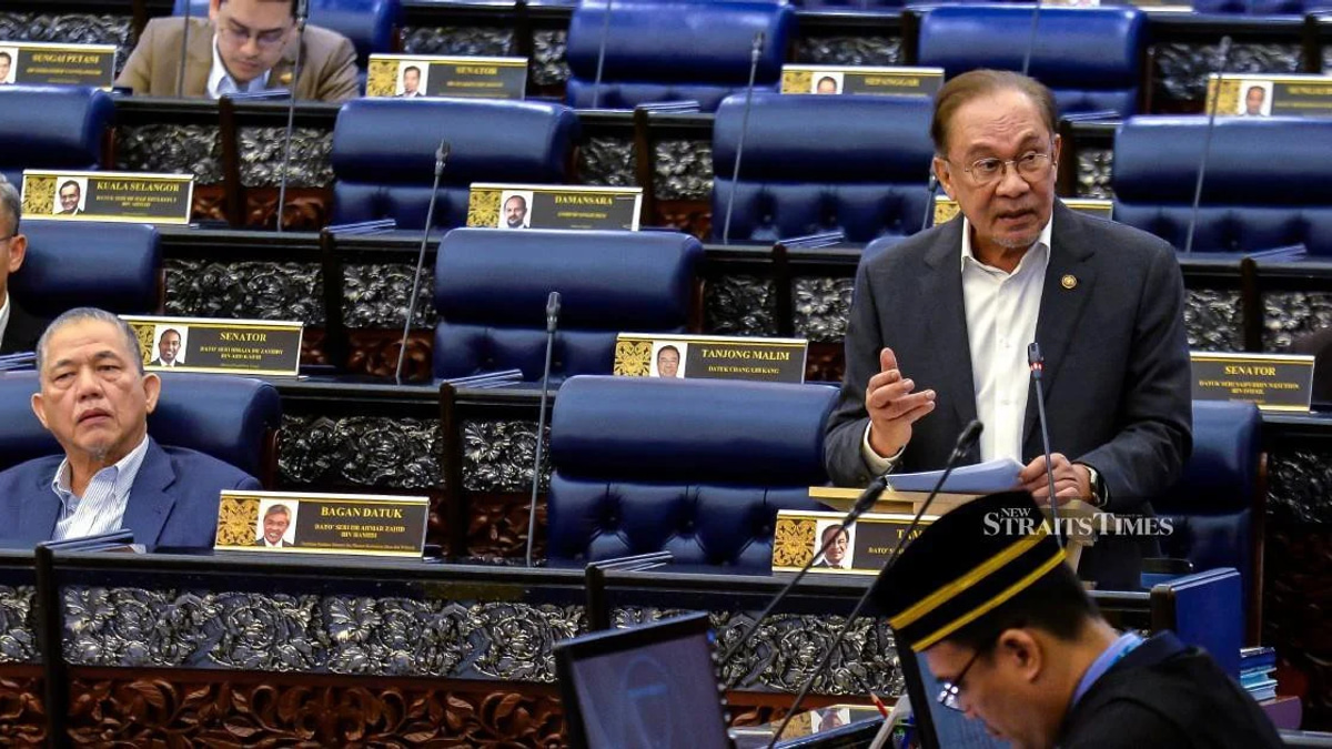 E-wallet firms must compensate scam victims within a week, Anwar says
