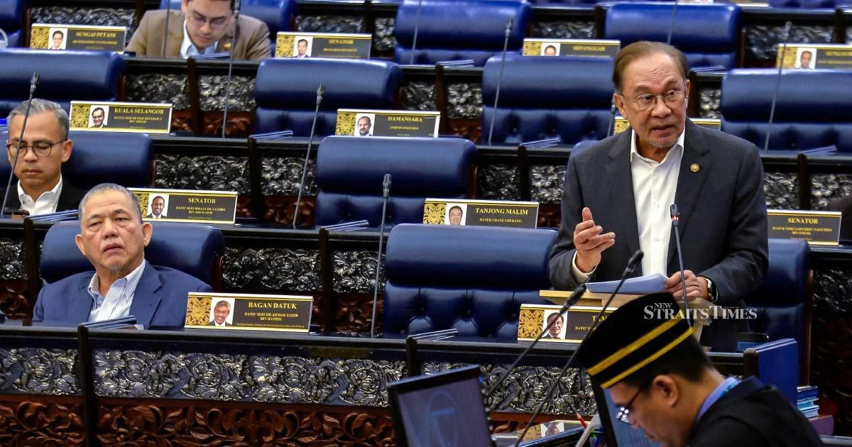 E-wallet firms must compensate scam victims within a week, Anwar says