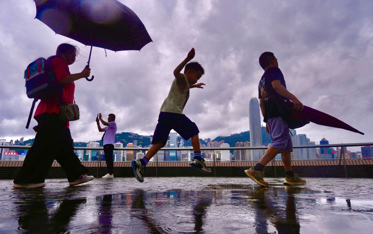 Hong Kong finds respite as torrential rain breaks relentless heat wave