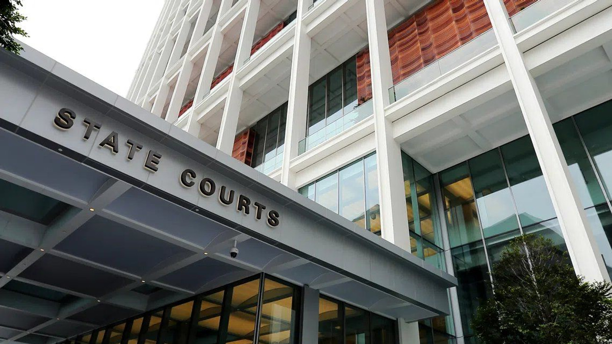 Director charged in S$32 million luxury goods fraud linked to Singaporean couple