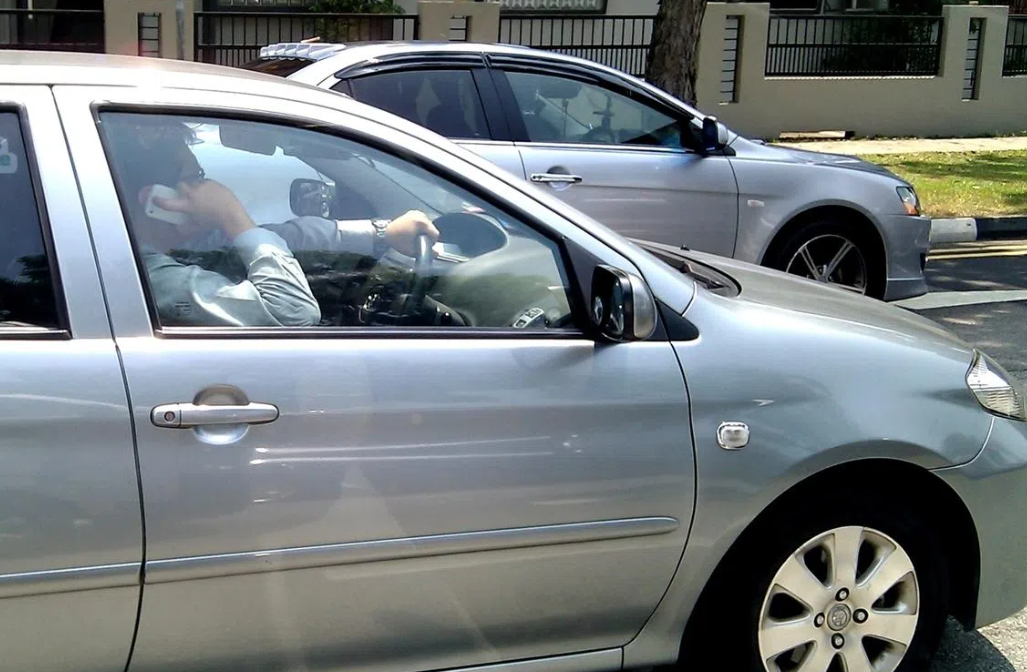 Singapore tightens traffic laws with jail time for holding phones while driving