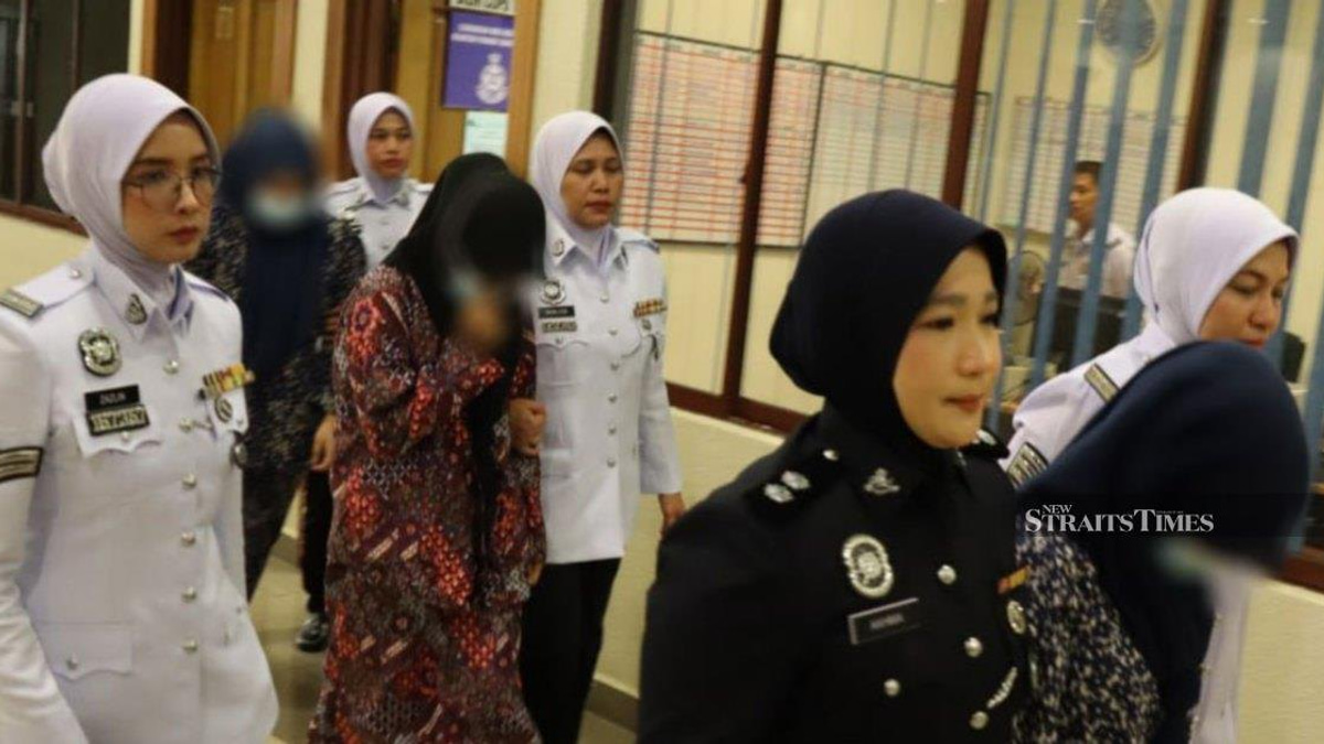 Three women charged for viral 'Superman' motorcycle stunt in Kuantan