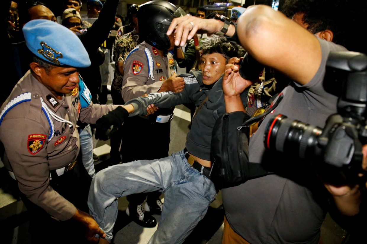 Indonesia charges four protesters after Surabaya anti-government rally over fuel prices and meal scheme
